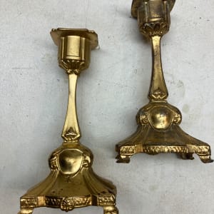 Pair of gold colored small candle sticks 