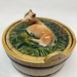 Majolica cow covered butter dish 