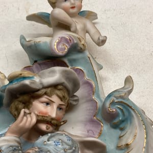 hand painted ornate porcelain figural plaque with cherub 