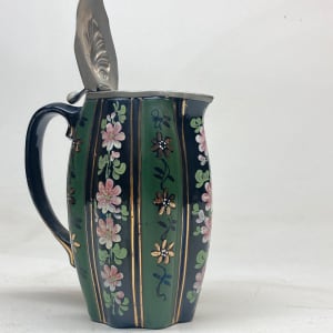 covered enameled pottery pitcher 