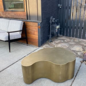 brass colored metal modern table 
