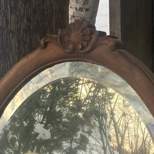 turn of the century oval mirror 