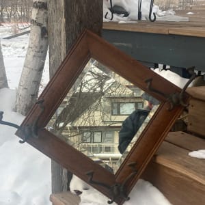 turn of the century oval mirror with hooks 