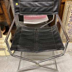 pair of chrome black directors chairs 