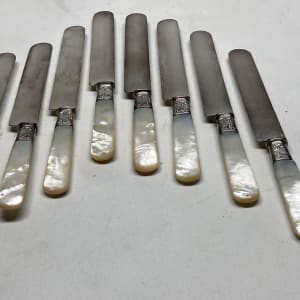 Set of 8 pearl handled turn of the century knives 