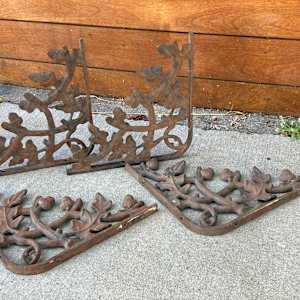 Turn of the century cast iron oak leaf brackets 