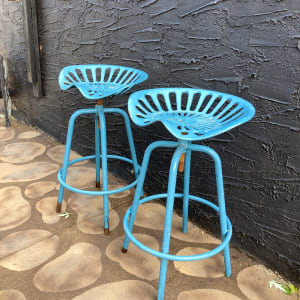 Pair of blue outdoor tractor seat stools 