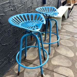 Pair of blue outdoor tractor seat stools 