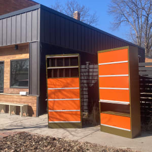 large orange and green metal filing cabinet 