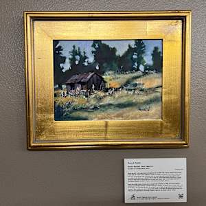 Ranch Cabin by Steven Randall  Image: “Artist organizations and galleries in the Black Hills of South Dakota have annually invited plein air artists to paint together in public on location. At the end of the event, artists show their work and generally enjoy interacting with the attending public, answering questions, and promoting South Dakota art. I painted ‘Ranch Cabin’ at one of these events, not just as a visually attractive relationship of visual elements, but also as a historic view of ranching as referenced in the National Register of Historic Places in Lawrence County, South Dakota.”