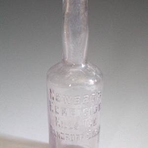 Bottle by DuPont M. Newbro