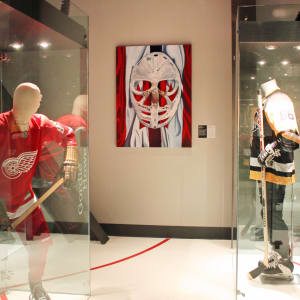 Goalie's Mask: red, white & Dryden (The Goalies Mask Painting) by Brandy Saturley  Image: Canada's Sports Hall of Fame, Calgary, AB