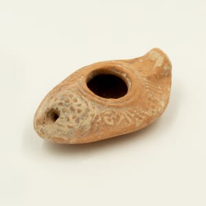 Terracotta oil lamp by Unknown