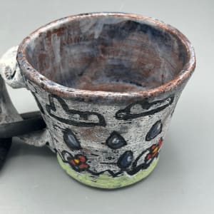 Cup Chained to a Hand by Caleb Paul 