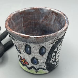 Cup Chained to a Hand by Caleb Paul 