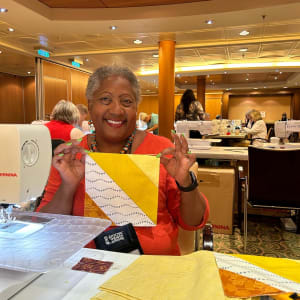 Flying Free Over the Allure of the  Seas by O.V. Brantley  Image: Me quilting on Allure of the Seas