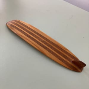 wooden surfboard by folk art unknown 