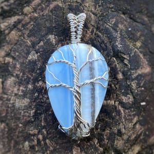 Top - Owyhee Blue Opal with silver-plated enameled copper wire tree by Pamela Dexter 