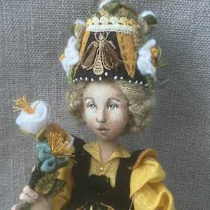 A Bee In Her Bonnet by Christine Shively Benjamin  Image: Close up of the Face and Hat