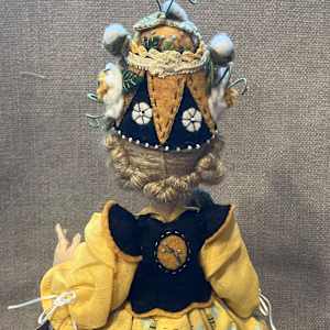 A Bee In Her Bonnet by Christine Shively Benjamin  Image: Close up of the upper back