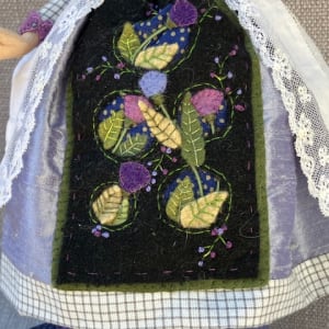 Thistle Maiden by Christine Shively Benjamin  Image: Close of felt cutwork and embroidery on the apron
