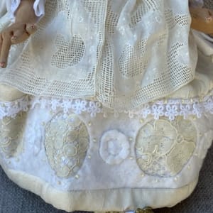 Angelica by Christine Shively Benjamin  Image: Close up of cutwork and lace skirt
