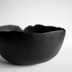 Thin black bowl, Image 1.