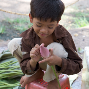 Boy with Flowers, Siem Reap, Cambodia by Bart Marcy
