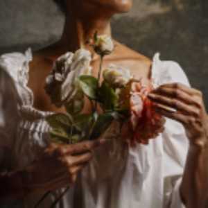 Woman with Flowers by Alanna Airitam