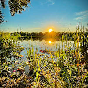 Kitty Hollow Lake at Sunset by Robert Johnson