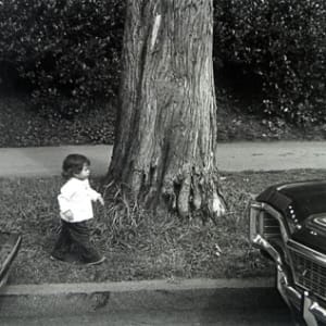 Little Girl Between Cars by Alan Hoffman