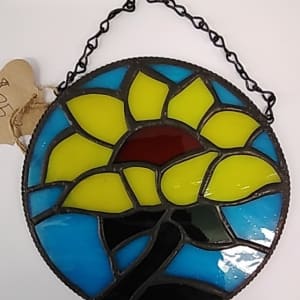 Sunflower with blue background, chain to hang by Craig Wills
