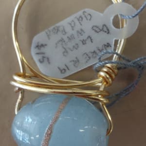 Oval Sky Blue & gold lampwork bead on gold by Becky Rump/Ware