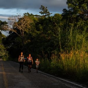Honduran migrants travel by foot after crossing the border into Chiapas, México by Verónica G. Cárdenas
