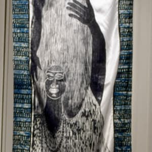 The Many Faces of Yemaya / Las Muchas Caras de Yemaya by Imna Arroyo  Image: Yemayá Akuará,  98 x33",  Woodblock prints on satin Satin framed with Batik fabric from Ghana;  2000 