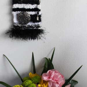 Peaceful Resilience  Mini Art Tapestry by Annette  Image:  Mini Tapestry on wall with floral display