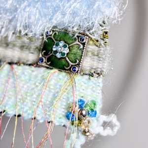 Tranquil Balance Mini Art Tapestry by Annette  Image: Found treasure are sourced from a local thrift that supports the intellectually & developmentally challenged. Vintage yarns & jewelry meticulously cleaned and repurposed into a hand woven one of a kind piece of artwork. 