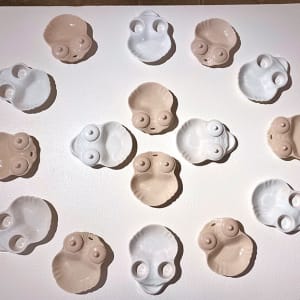 'Departed Grandmothers: Aprons and Skulls'  Image: Skull shaped dishes were made from altered Apron pattern. Twelve (12)ceramics were exhibited.