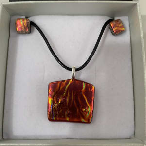 Textured Orange red pendant set by Inez Jenkins