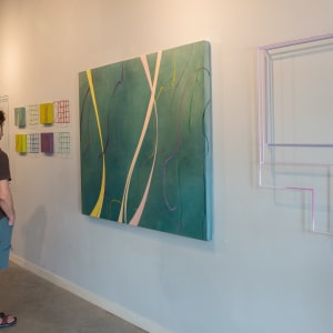 Drought Tolerant III by Alicia Philley  Image: Image 3: Installation side view from my two-person exhibition at Link & Pin Gallery. In the foreground hangs the 50" x 60" painting "Drought Tolerant III." In the background is the vivid yellow "Cameron Loop" series, inspired by the colors of Huisache trees. Painted metal wall sculptures by Emily Hoyt-Weber.