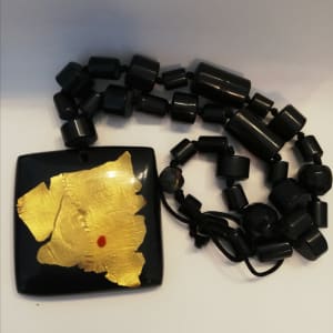 Black Square Pendant with 24 Karat gold leaf inlay, on tube bead necklace.