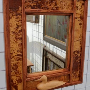 Small Mirror with Carved Duck