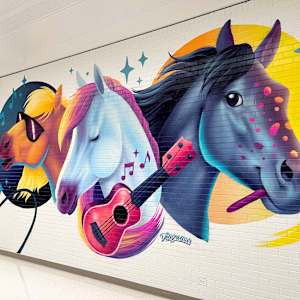Be Herd by Julia Williams, The Designosaur  Image: "Be Herd" by Julia Williams, aka The Designosaur, 2024; full view of mural taken from right-hand side.