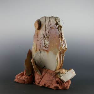 Harbinger by Danielle Callahan  Image: View with shards embedded in ceramic and wads intentionally retained post wood firing.