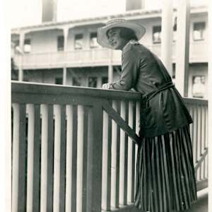 Art Outside the Box Take 2: Avenida del Sol & Orange Avenue by Sophia Hodges, Rebekka Siqueiros  Image: A hotel guest at the Hotel del Coronado leans over the balustrade on the second-story verandah overlooking the hotel’s interior courtyard. Date unknown. Coronado Historical Association Collection. Rights reserved.
