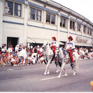 Art Outside the Box Take 2: Adella and Orange Avenue by Jasmine Lo, Jocain Howard  Image: The long, curving Spreckels Building as the backdrop for the 4th of July parade. 1991. Coronado Historical Association Collection. Rights reserved.
