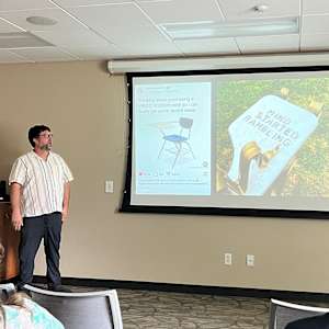 Mind Started Rambling by Dylan Collins  Image: Dylan Collins presenting his work at a public talk.