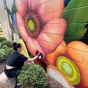 Pearl Fu Plaza Mural (Untitled) by Wingchow (Christina Wing Chow)  Image: Wingchow at work on the untitled mural.