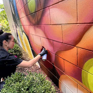 Pearl Fu Plaza Mural (Untitled) by Wingchow (Christina Wing Chow)  Image: Wingchow at work on the untitled mural.