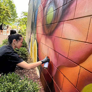 Pearl Fu Plaza Mural (Untitled) by Wingchow (Christina Wing Chow)  Image: Wingchow at work on the untitled mural.